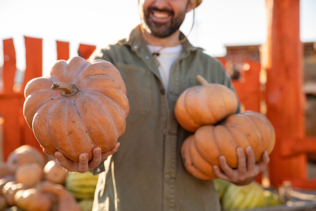 Man holding pumpkins