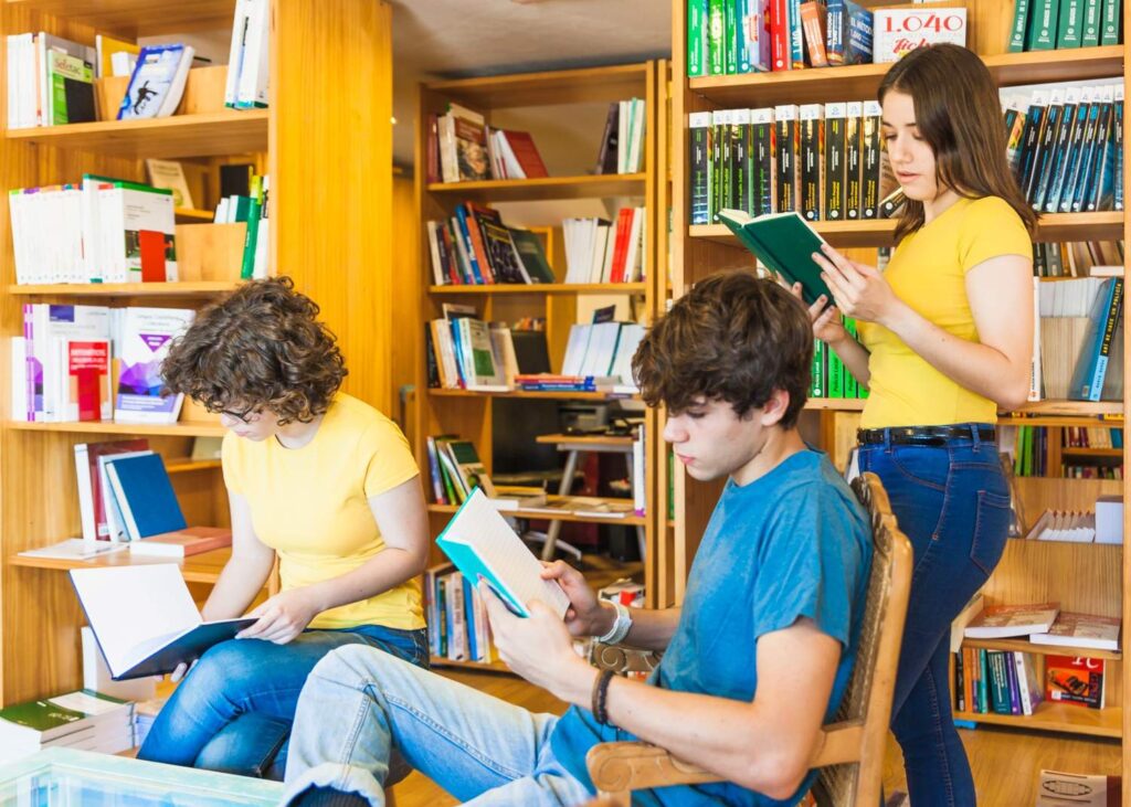Teenagers reading in the library