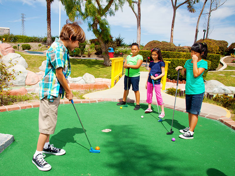 Children playing mini golf