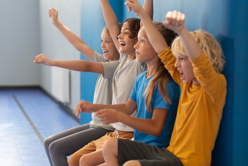 Group of children doing wall sits